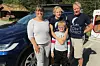 TIL LOFOTEN. Tove (44), Anders (14), Alfred (9) og Eindride (46) Singstad stoppet på Storjord i Saltdal nylig for å hurtiglade Teslaen, da de var på sin aller første Nord-Norgesferie. Foto: Maria E. Trondsen