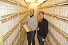 160.000 HYLLEMETER. Ole Myhre Hansen (t.v.) og John Erik Østrøm mellom to av et enormt antall hyller på et kjempestort område i Riksarkivet. Foto: Stig Bjørnar Karlsen